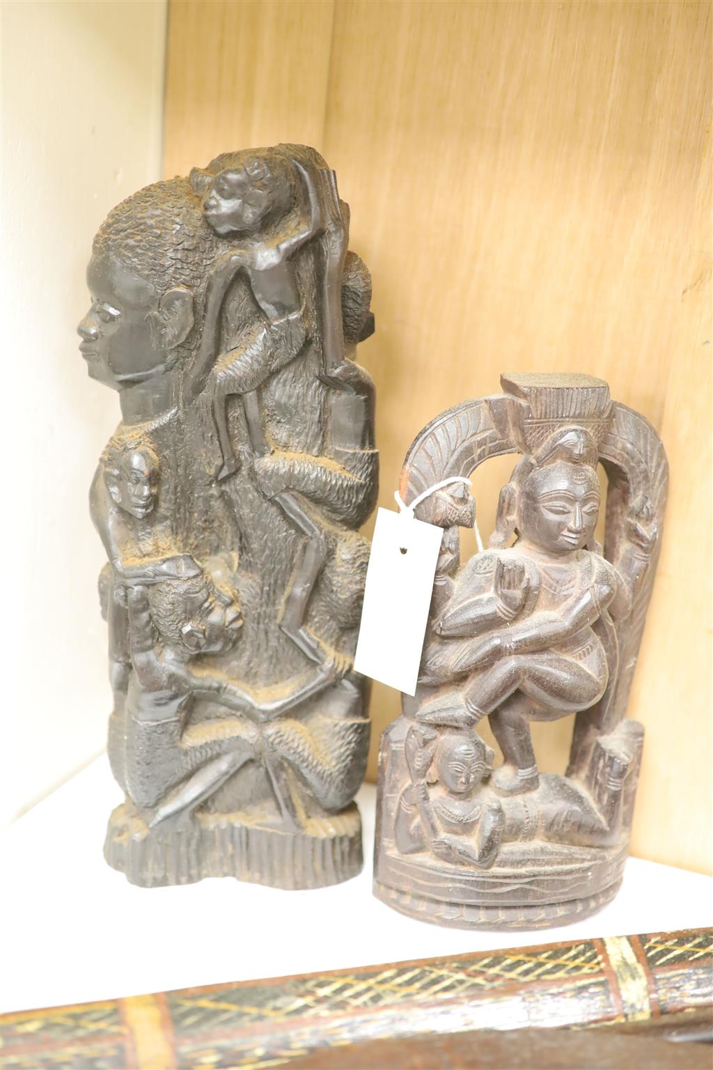 Ethnographia, a collection of various wood carvings, including an African tall female fertility figure,